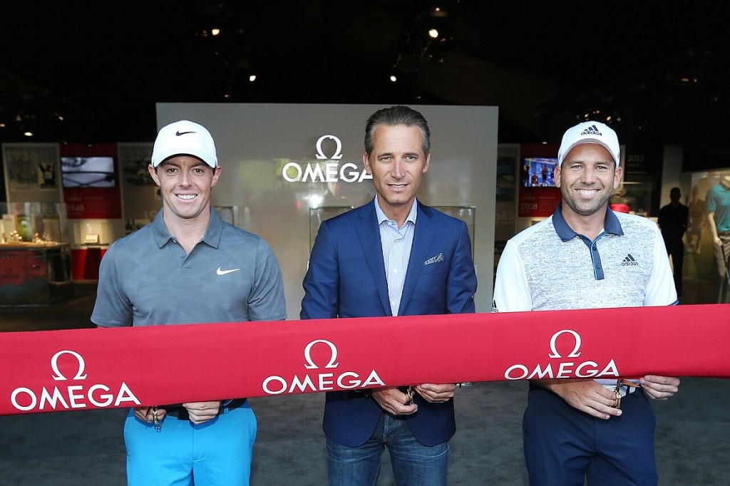Top-ranked golfers and OMEGA Ambassadors Rory McIlroy and Sergio Garcia join OMEGA Vice President and International Sales Director, and Member of Swatch Group's extended group management board Raynald Aeschlimann, at a special ribbon-cutting ceremony to officially open the OMEGA Exhibition at the 2015 PGA Championship at Whistling Straits in Sheboygan, Wisconsin.