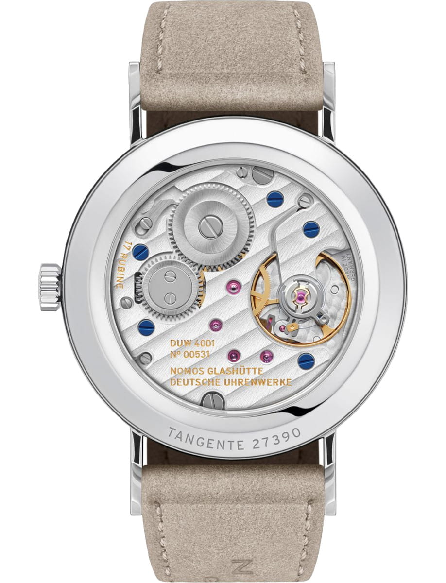 Wristwatch with a sapphire crystal case back showing silver gears and blue screws, vegan velour leather strap.