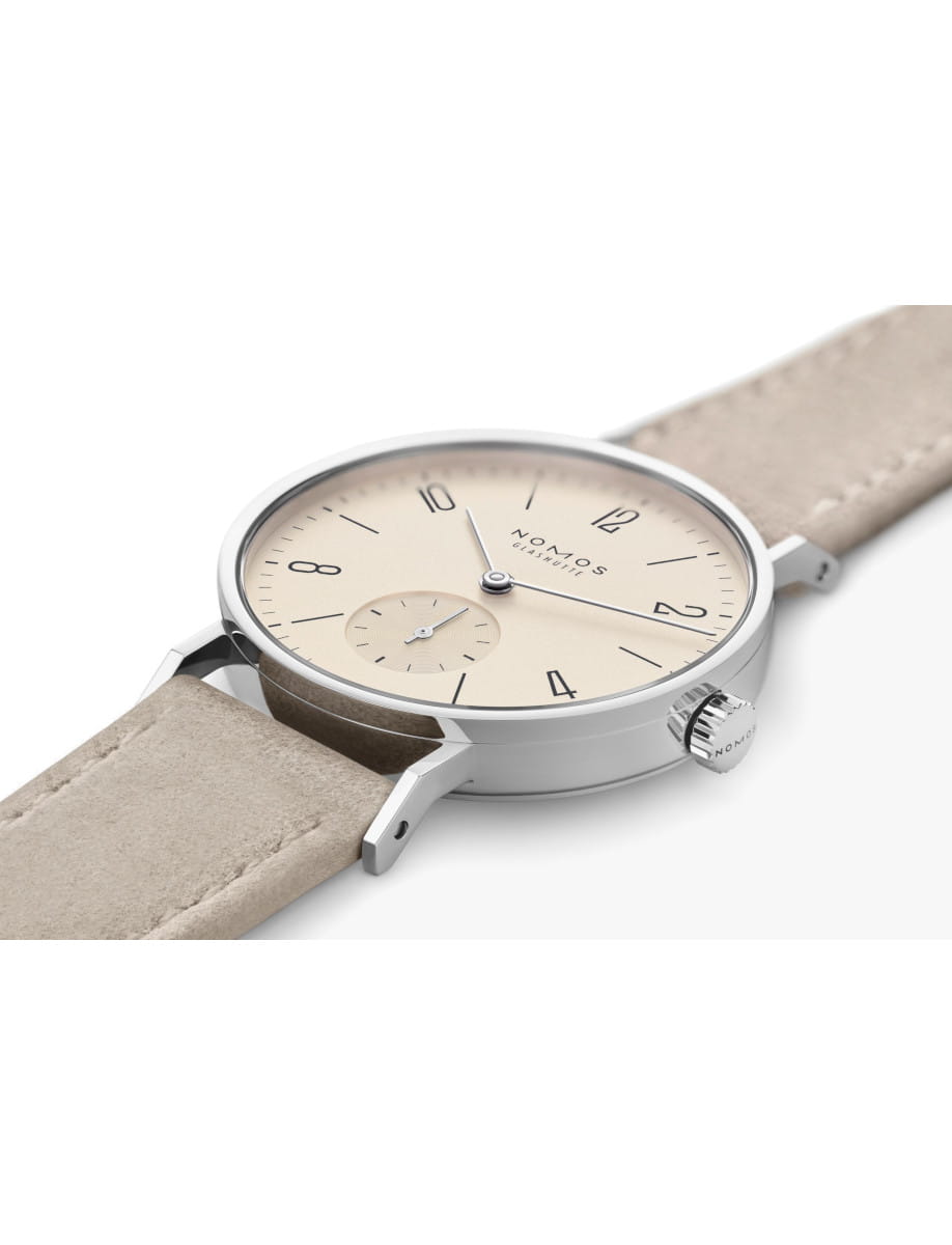 Nomos Glashütte wristwatch with champagne dial, steel case, and vegan velour leather strap.