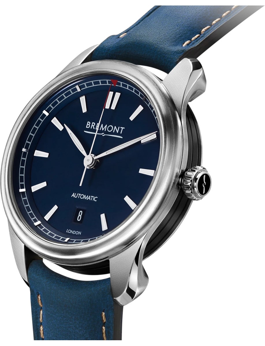 Side view of Bremont wristwatch with stainless steel case, blue dial, and blue nubuck strap.