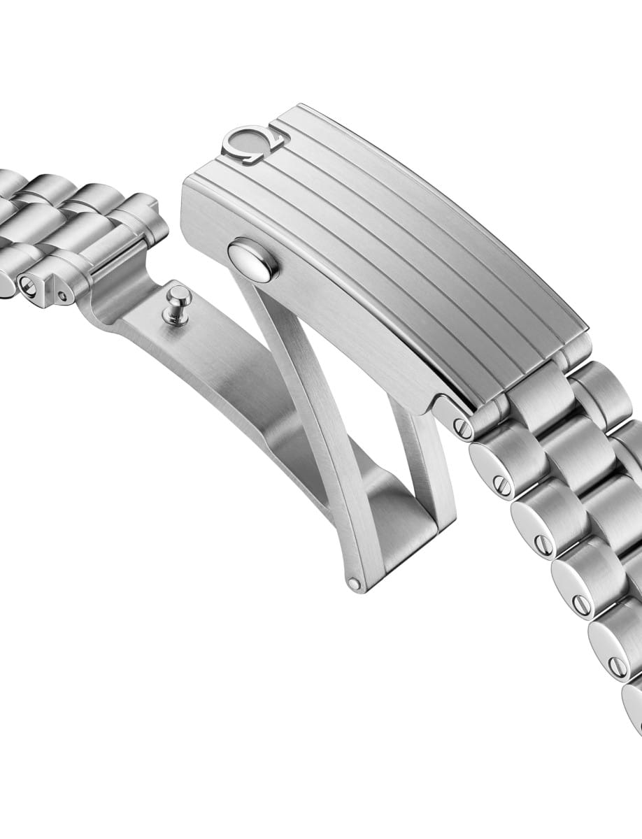 Stainless steel watch bracelet with a deployment clasp and push-button lock, shown in close-up on a white background.