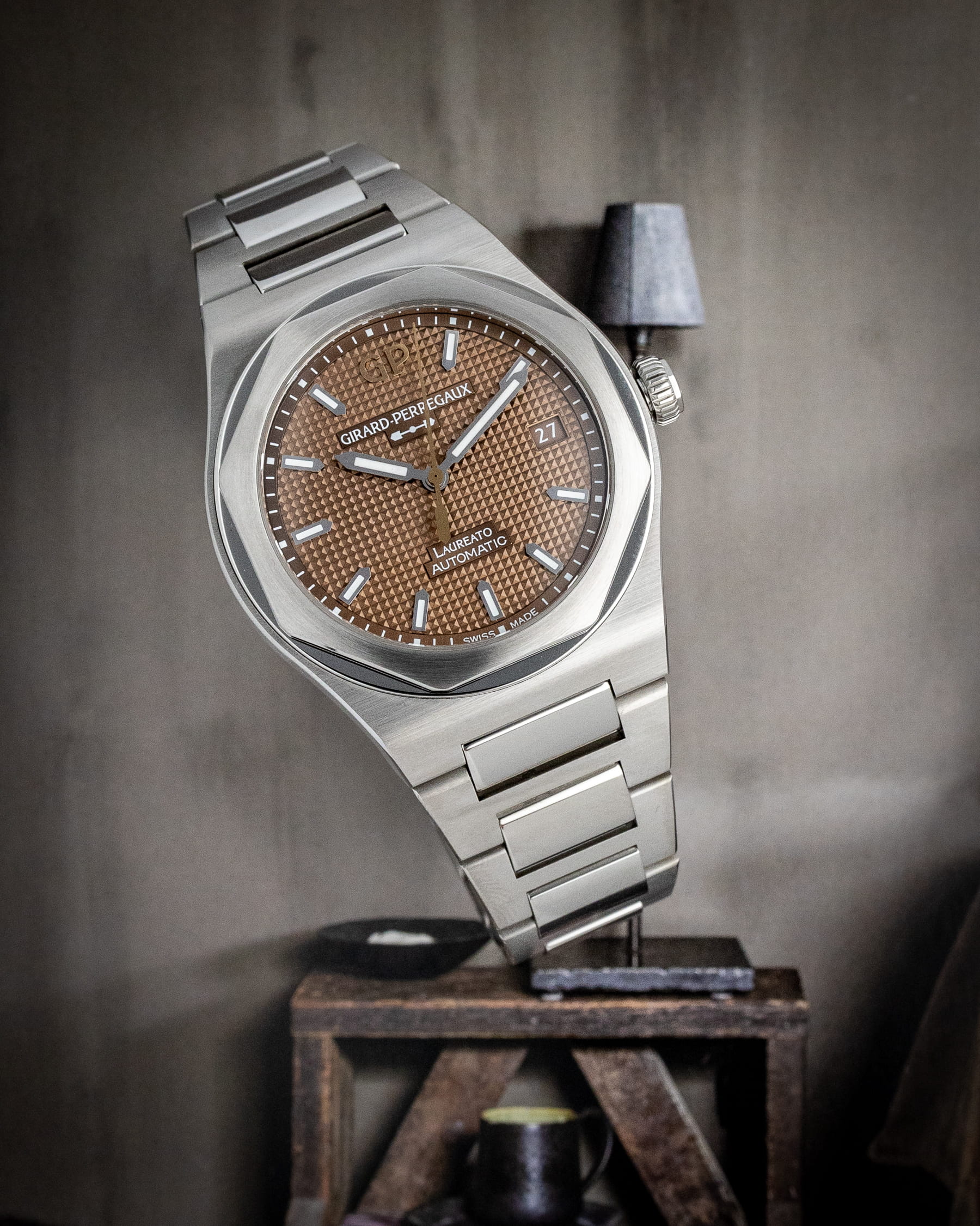 Hotlist image for Girard Perregaux Laureto wristwatch with stainless steel case and bracelet, and sunray cooper colored dial.