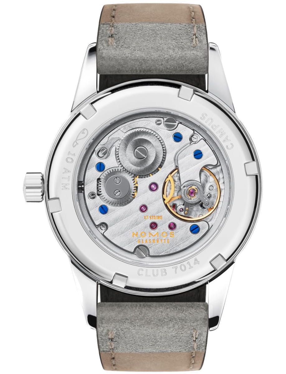 Nomos wristwatch with stainless steel case, vegan velour strap, and sapphire crystal case back.