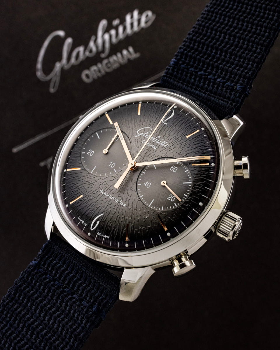 Hotlist image for Glashutte Original Vintage Sixties Chronograph Annual Edition wristwatch with stainless steel case, grey black dial, and blue synthetic strap.