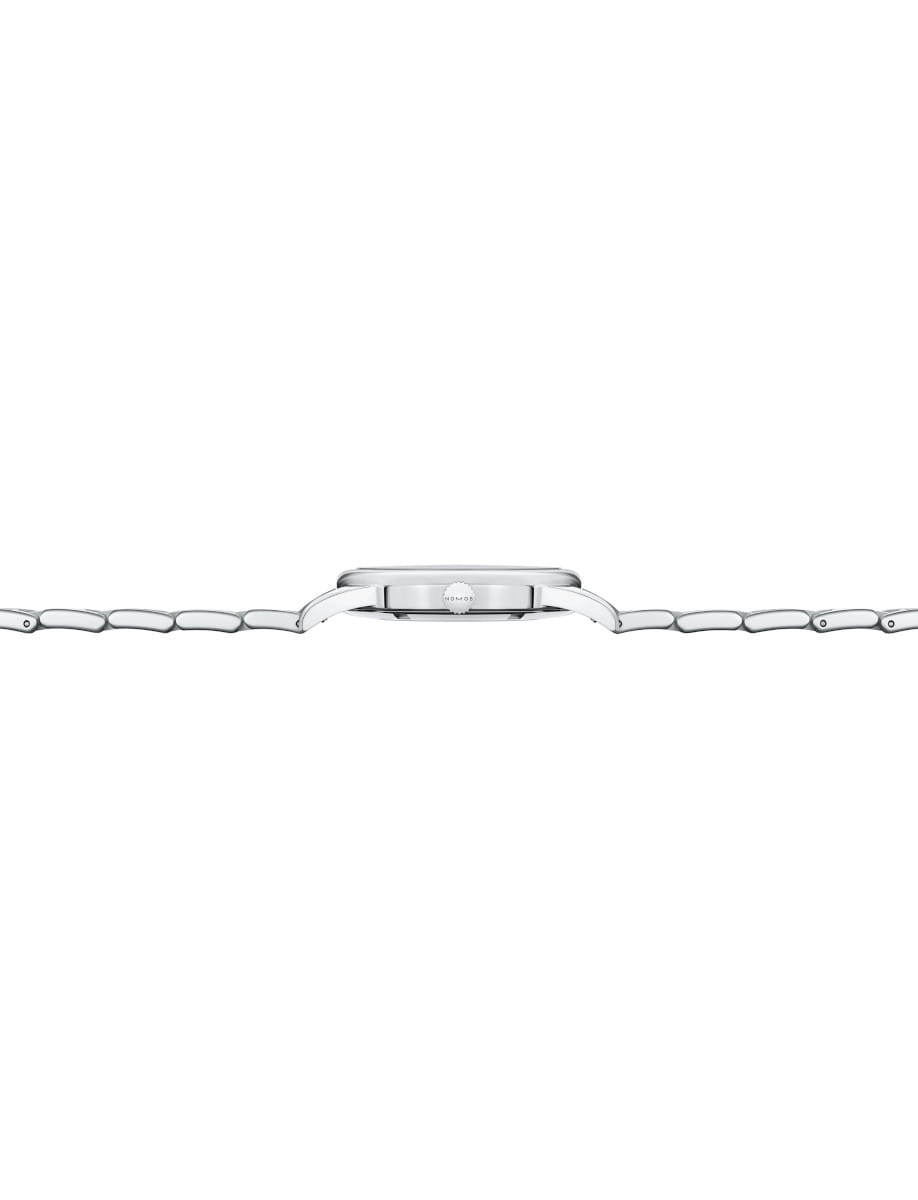 Side view of a Nomos Glashutte wristwatch with stainless steel case and bracelet.