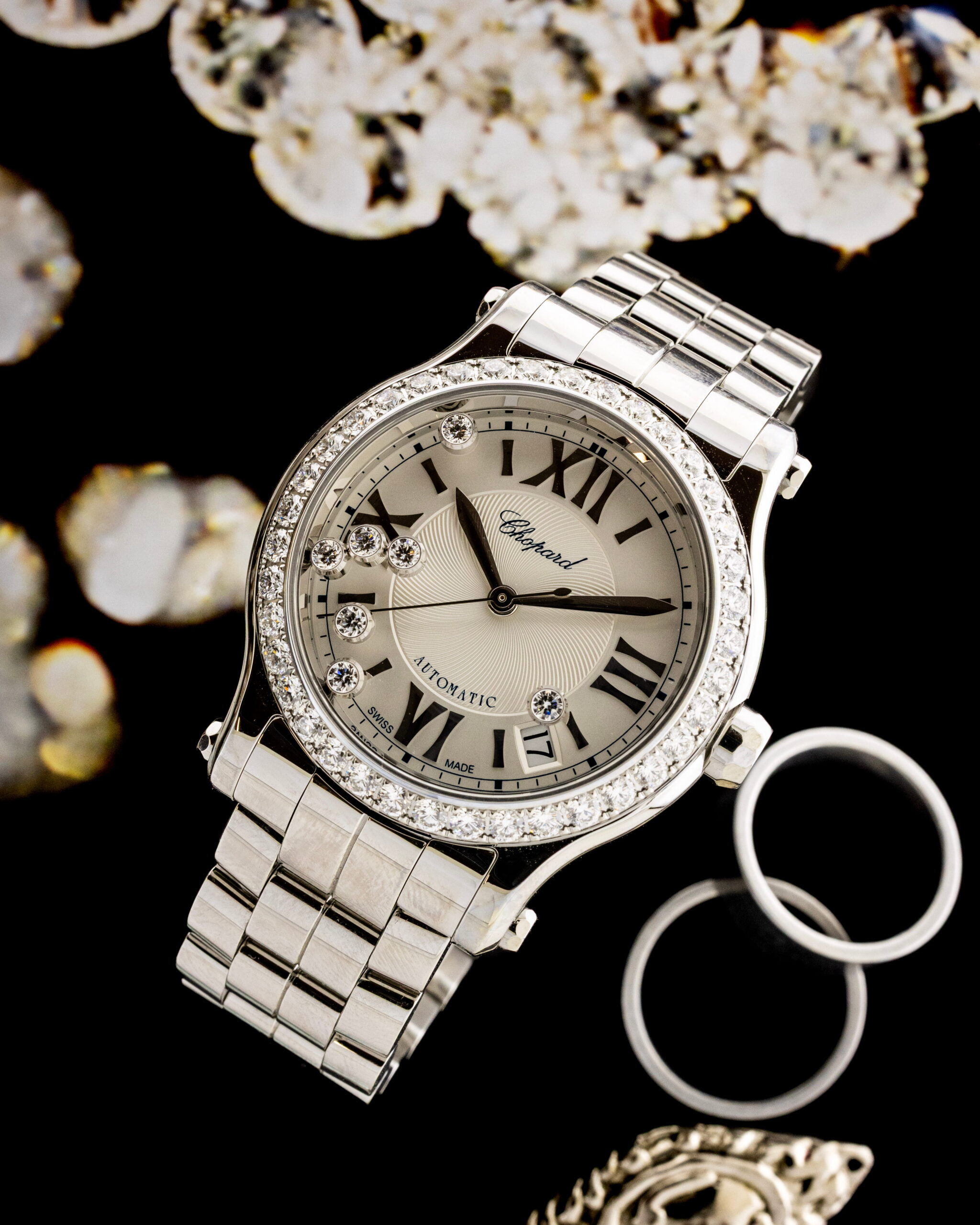 Hotlist image for Chopard Happy Sport wristwatch with stainless steel case and bracelet, diamond bezel, and silver-colored dial.