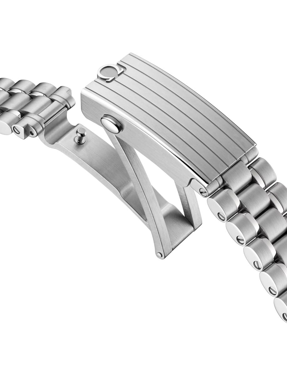 Close-up of a stainless steel link bracelet with a folding deployment clasp.