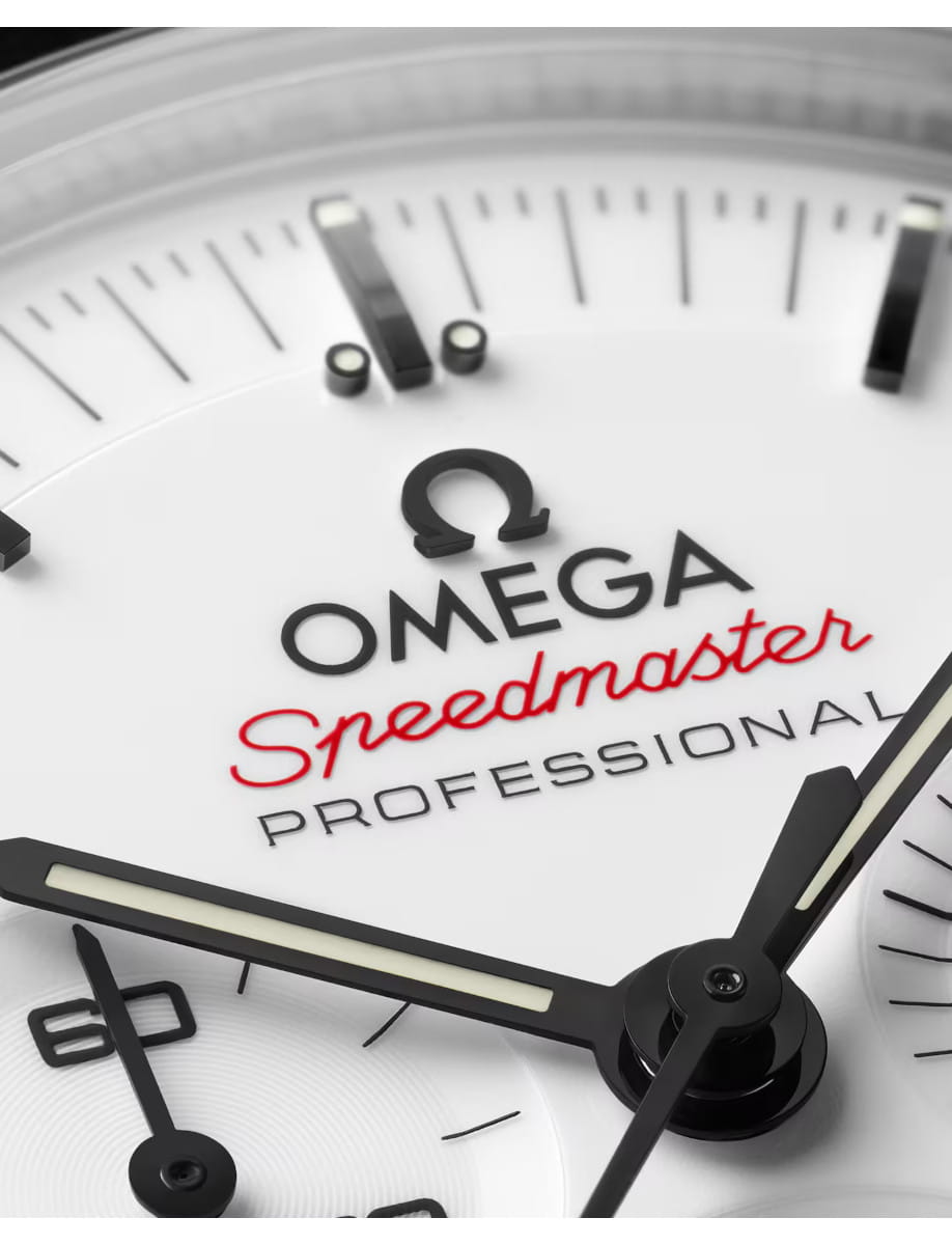 Close-up of the Omega Speedmaster Professional watch dial and hands on a white face.