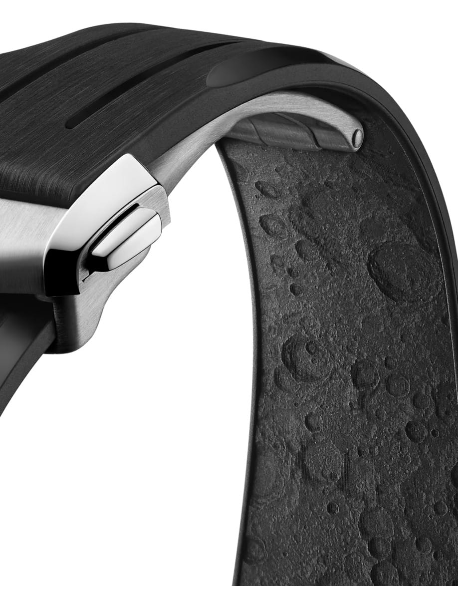 Close-up of a black over-ear headphone showing the metal hinge and cushioned ear cup.