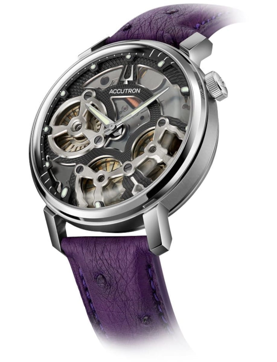 Side view of Accutron wristwatch with stainless steel case, black dial, and american alligator strap.