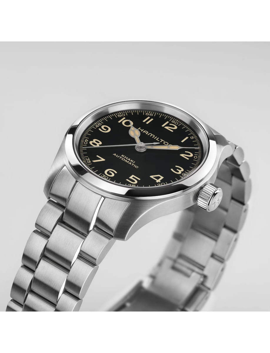 Right side view of Hamilton wristwatch with stainless steel case and bracelet, and black dial.