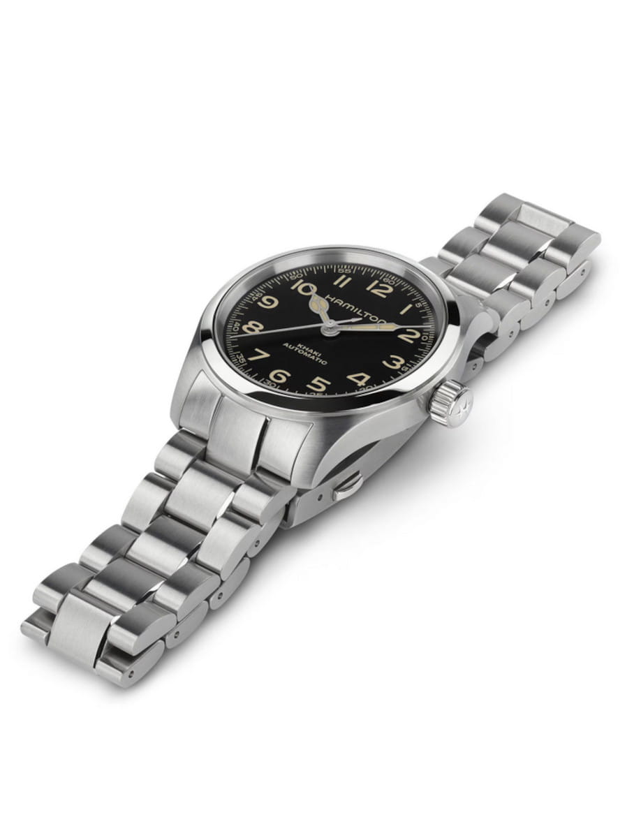 Front right view of Hamilton wristwatch with stainless steel case and bracelet, and black dial.