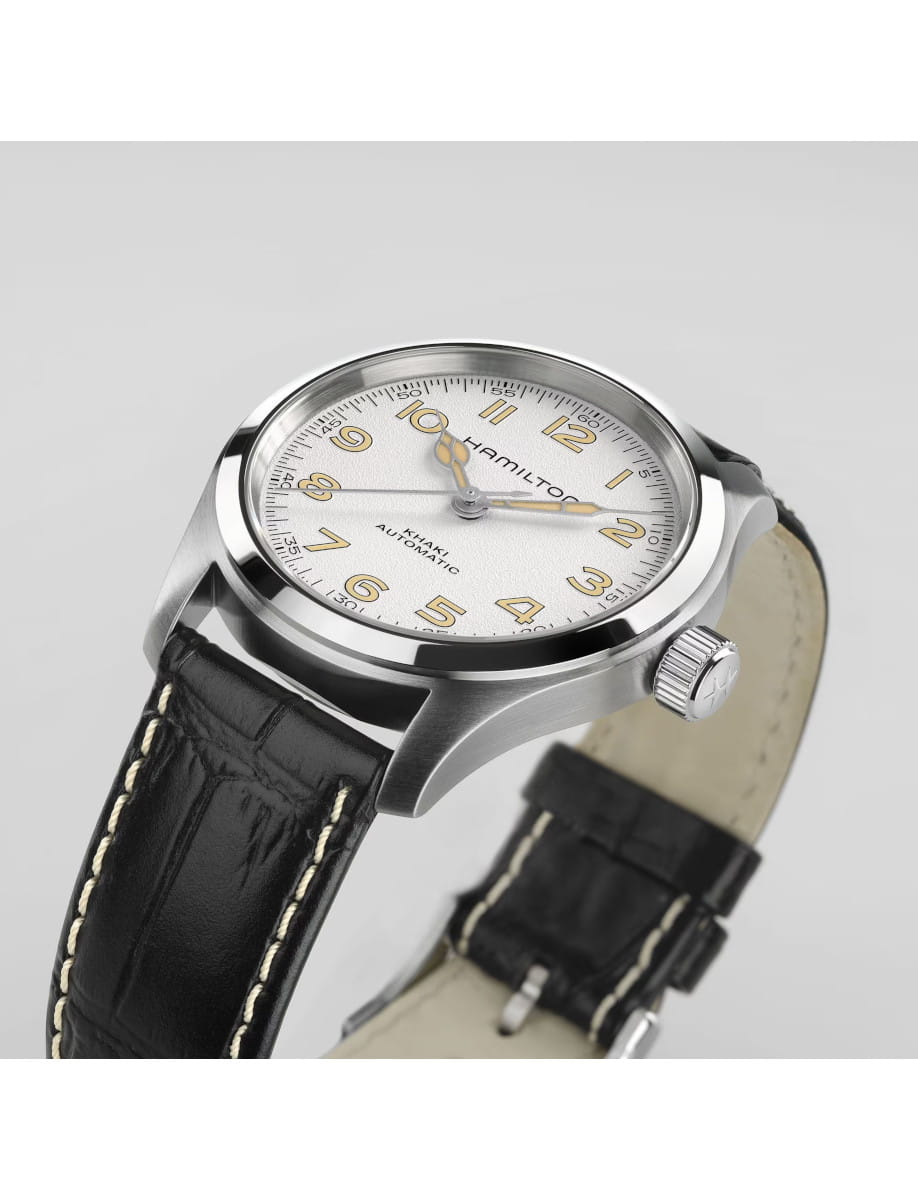 Side view of Hamilton Khaki Automatic wristwatch with white dial, stainless steel case and black calf leather strap