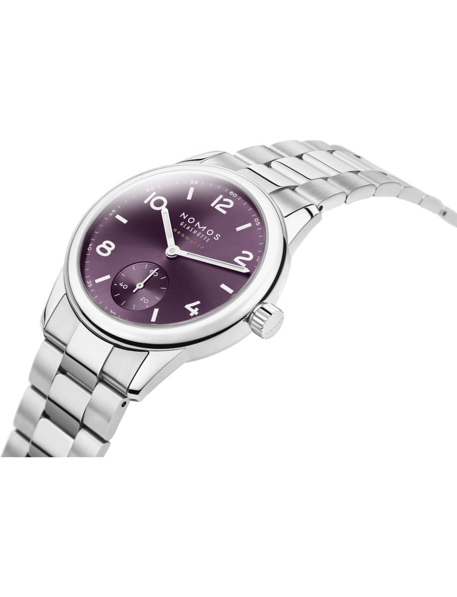 Side view of Nomos Glashütte Neomatik wristwatch with a purple sunburst dial, stainless case and bracelet.