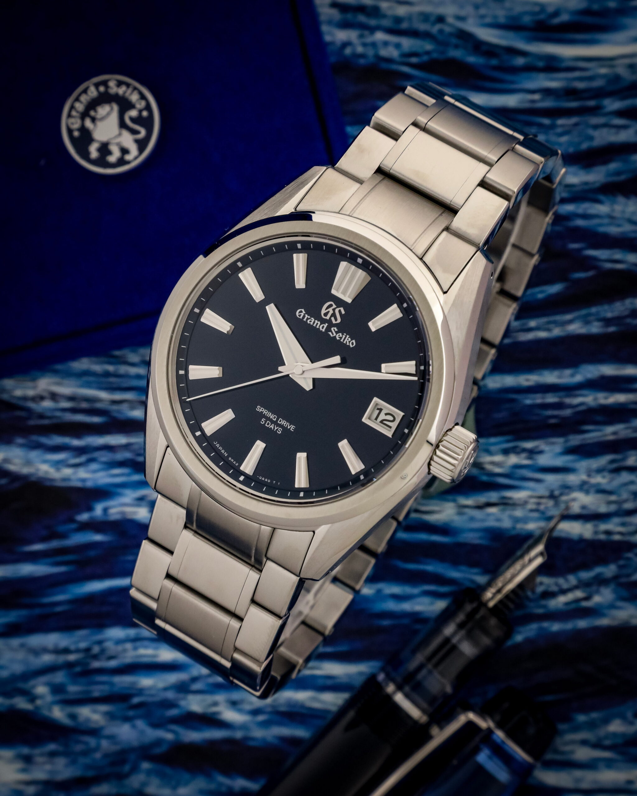 Hotlist image for Grand Seiko wristwatch with stainless steel case and bracelet, and blue dial.