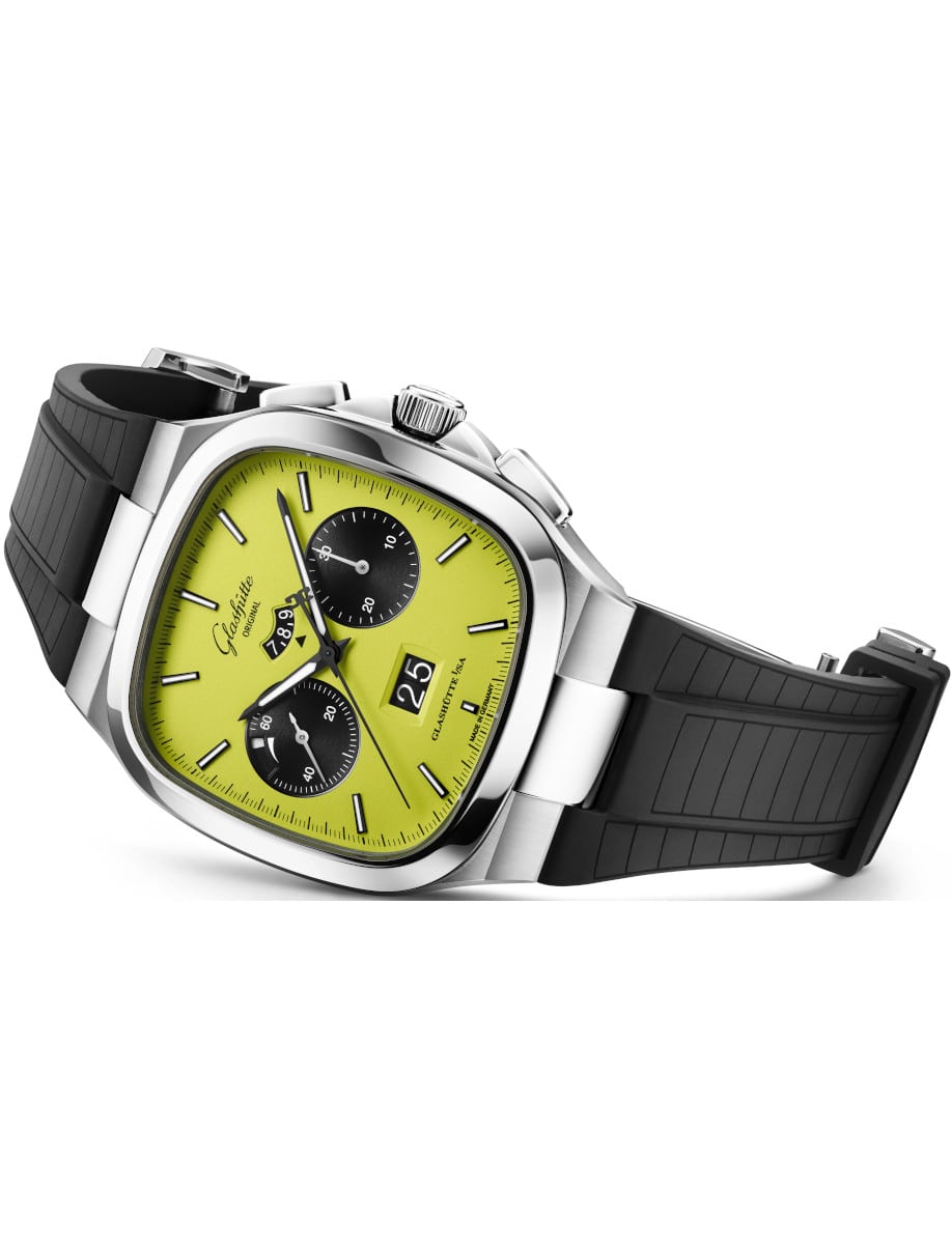 Side view of Glashutte Original wristwatch with stainless steel case, a light green dial, and a black rubber strap.