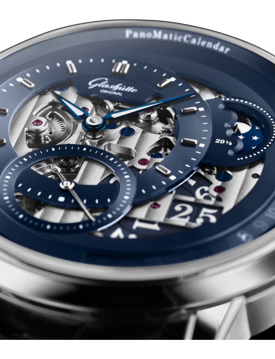 Close view of the blue skeleton dial of Side view of Glashütte Original wristwatch with platinum case.