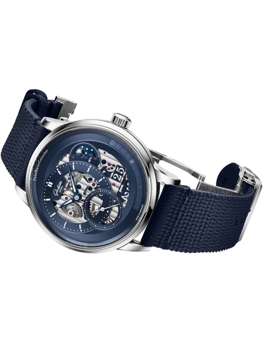 Side view of Glashütte Original wristwatch with platinum case, blue dial, and blue synthetic strap.