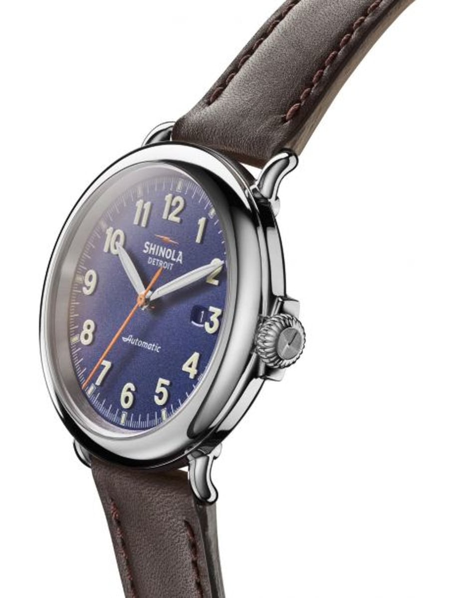 Side view of Shinola wristwatch with stainless steel case, blue dial and leather strap