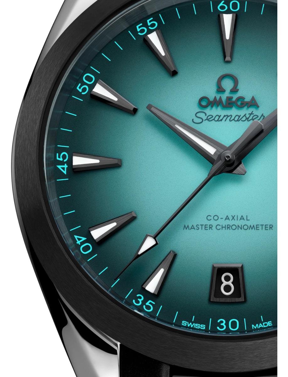 Closer view of Omega wristwatch with stainless steel case, black ceramic bezel and turquoise dial
