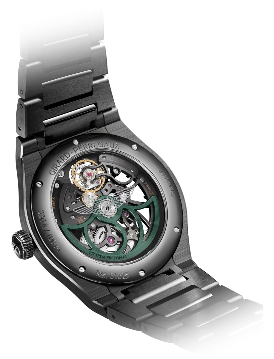 Back view of a black ceramic wristwatch showing the automatic movement through a transparent exhibition case back.