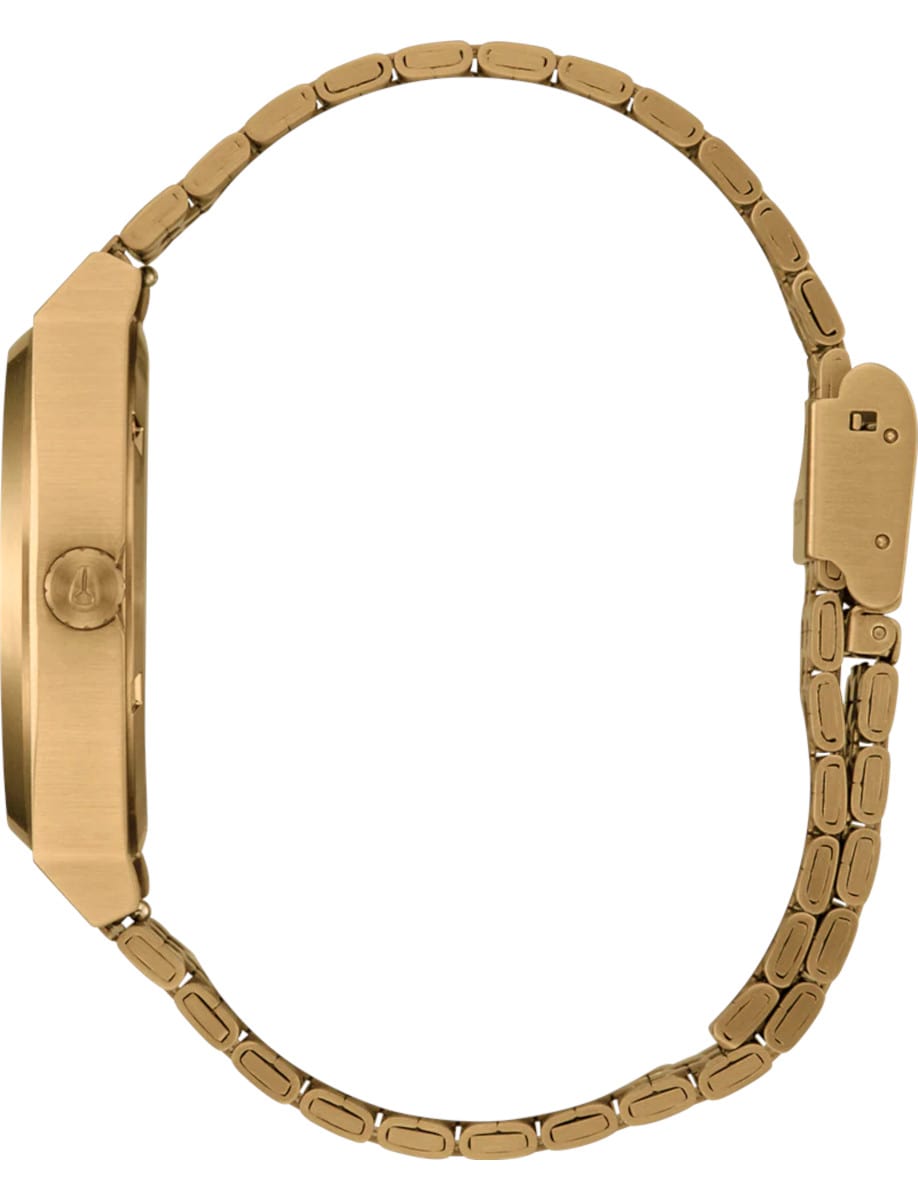 Side view of Nixon wristwatch with gold-tone stainless steel case and bracelet.