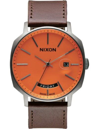 Nixon Regent wristwatch featured in stainless steel, automatic movement, orange dial, brown leather strap with stainless steel folding buckle. | Feldmar Watch Co. Nixon Regent wristwatch featured in stainless steel, automatic movement, orange dial, brown leather strap with stainless steel folding buckle.