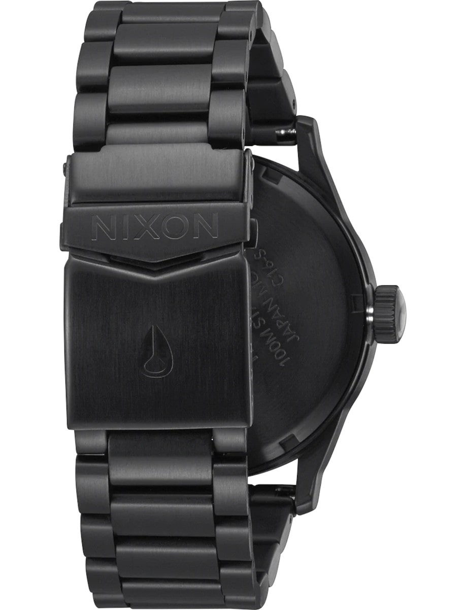 Back view Nixon wristwatch with stainless steel case and bracelet, and a black dial.