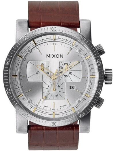 Nixon wristwatch with stainless steel case, silver dial, and a brown leather strap