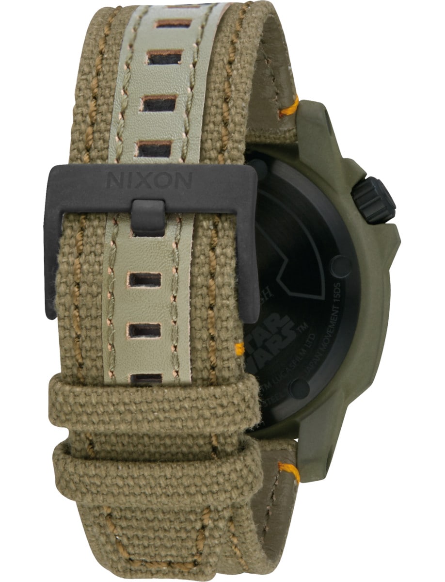 Back view of Nixon wristwatch with stainless steel case, and a green textile strap.