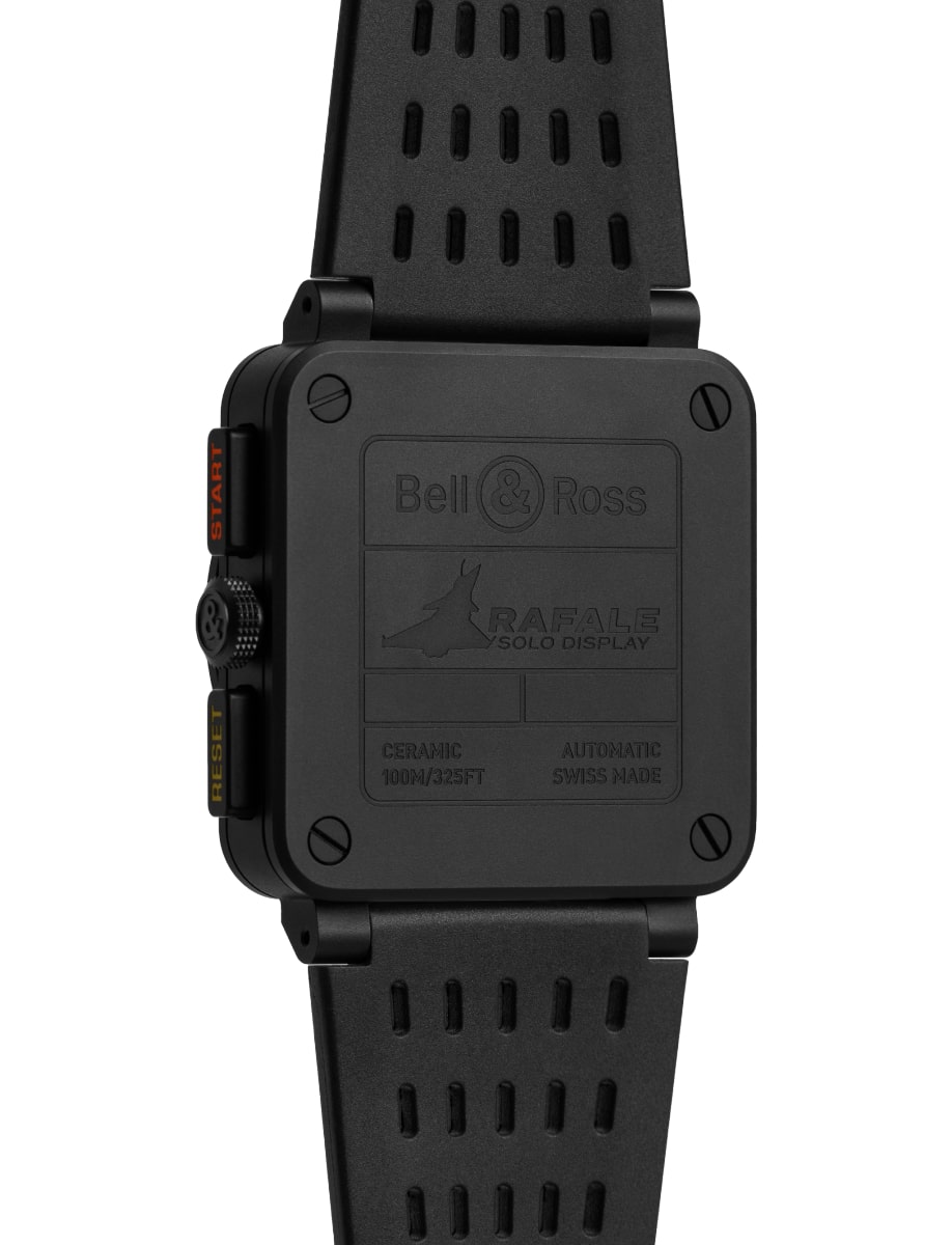 Back view of Bell&Ross wristwatch with micro-blasted black ceramic case, matte black dial, and black openworked rubber and ultra-resilient black synthetic fabric with Rafale Solo Display logo marking.