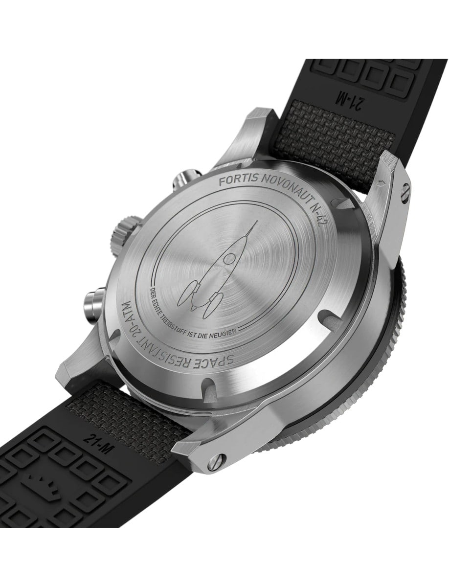 Case back of a wristwatch with a recycled stainless steel case, and a hybrid rubber/textile fabric strap.