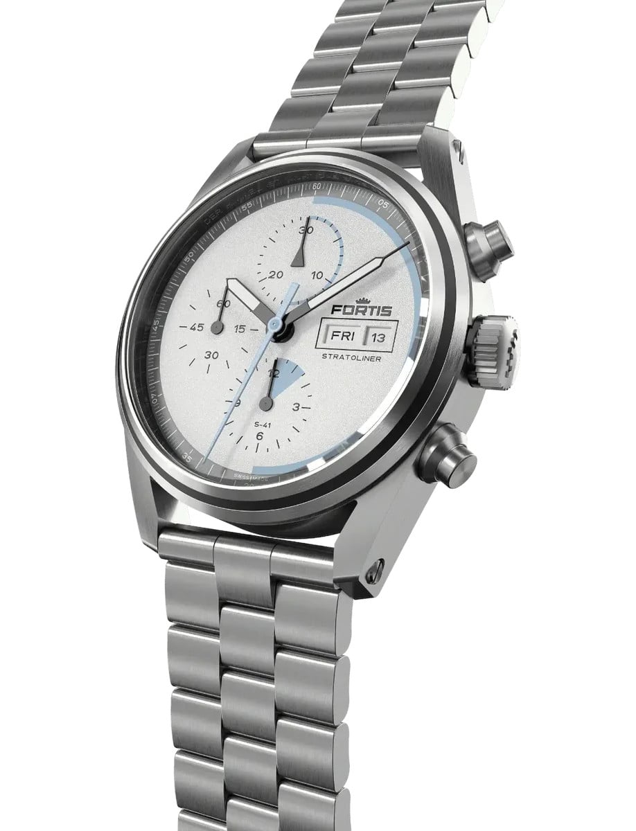 Side-angled view of a Fortis wristwatch with a recycled stainless steel case and bracelet, featuring a White Stardust dial with blue Superluminova® X1 space-travel markings.
