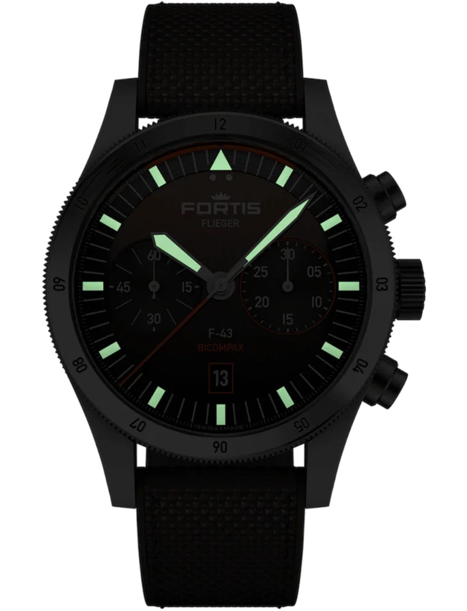 Fortis wristwatch with a recycled stainless steel case, shown at night with glowing indexes and hands