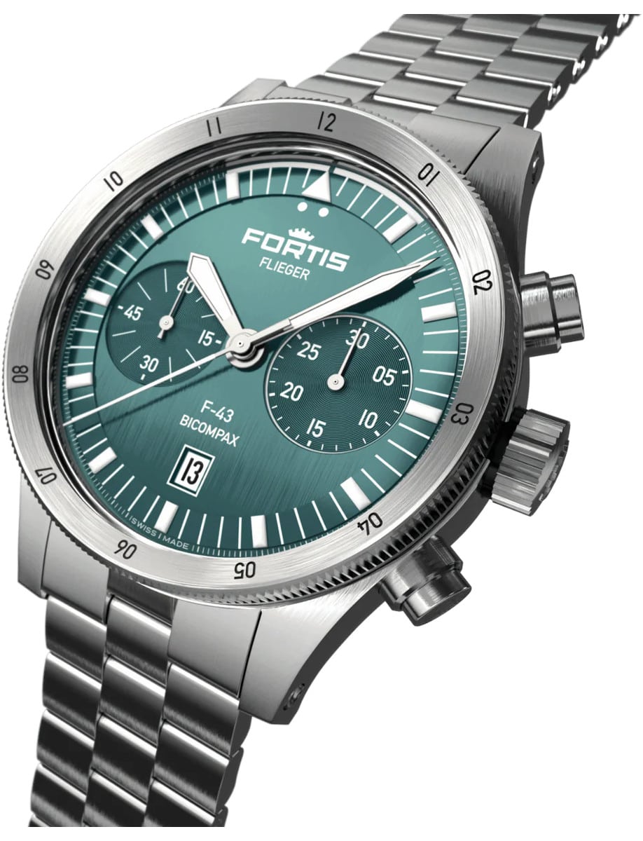 Side view of Fortis wristwatch with recycled stainless steel case and bracelet, and a vertically brushed petrol dial