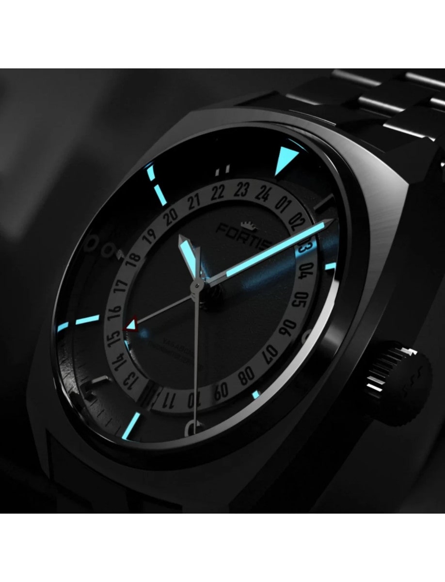 Fortis wristwatch with titanium case, shown in the dark with glowing indices and hands