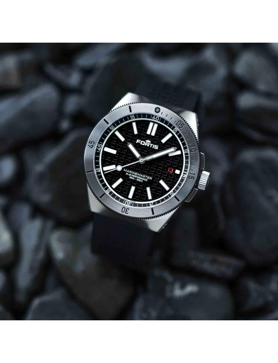 Side view Fortis wristwatch with recycled stainless steel, black dial and rubber strap
