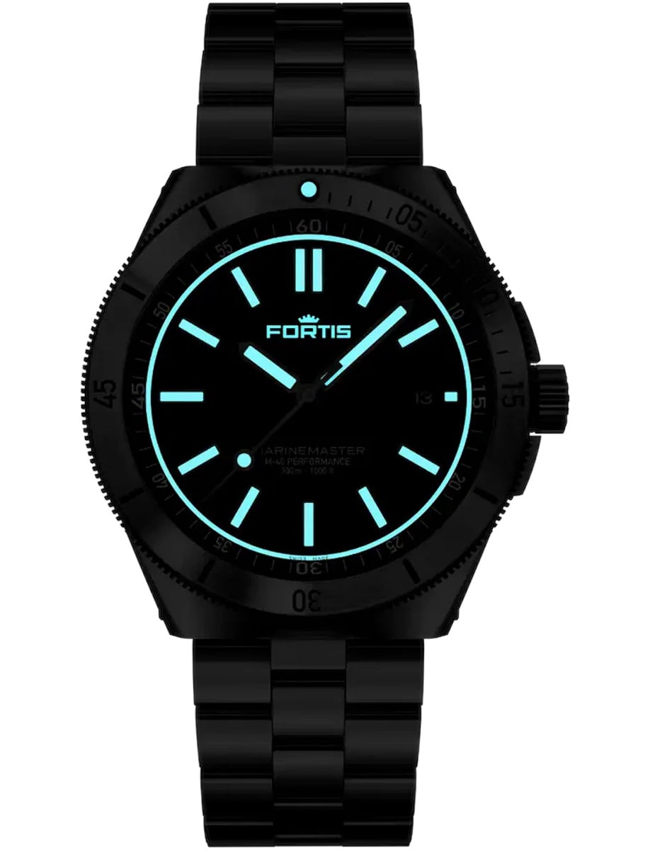 Night photo of Fortis wristwatch with Superluminova®X1 with blue glow