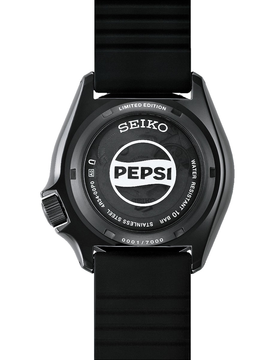 Back view of a Seiko wristwatch with stainless steel case, and a black silicone strap.