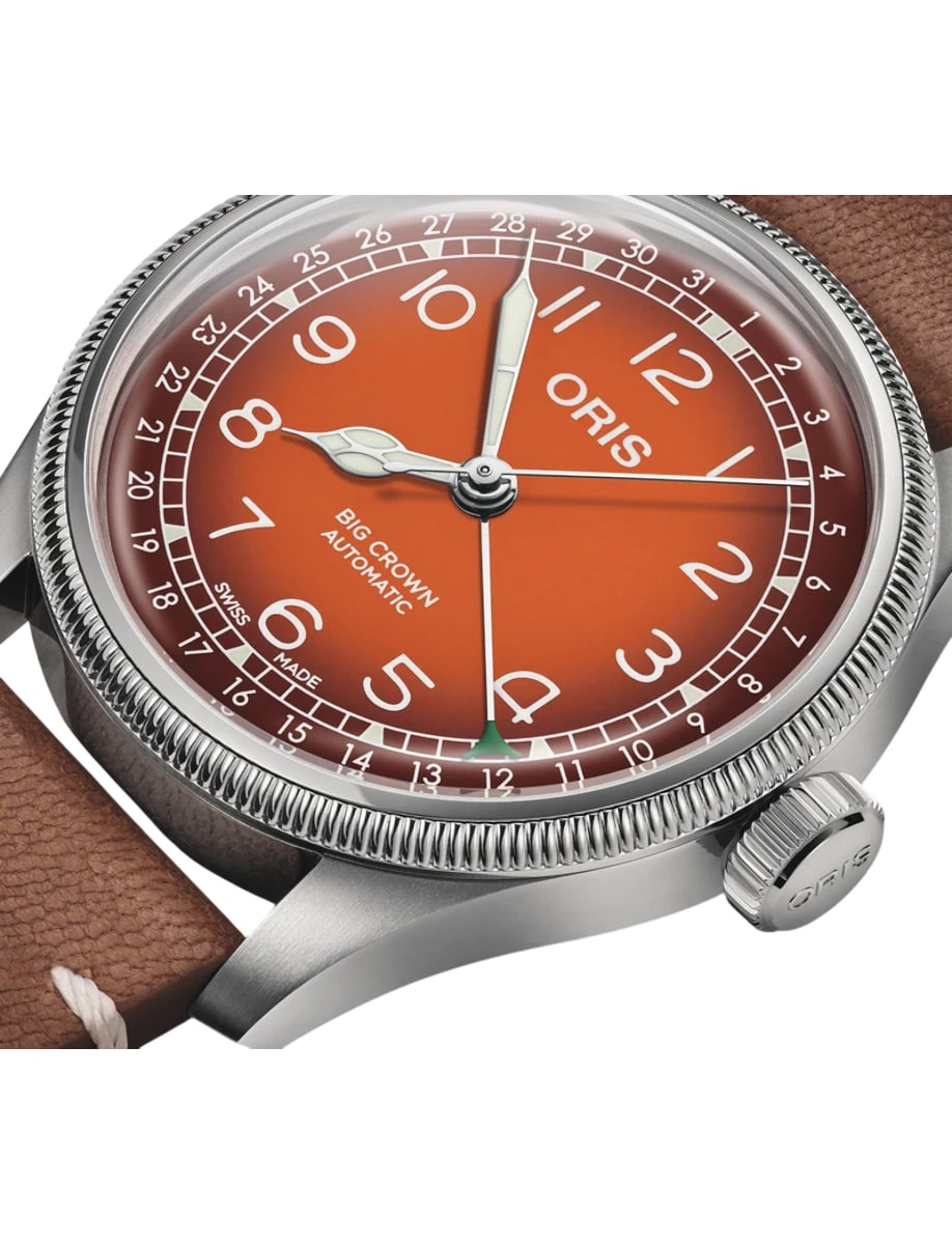Closer view of Oris wristwatch with stainless steel case, orange dial and brown Cervo Volante deer leather