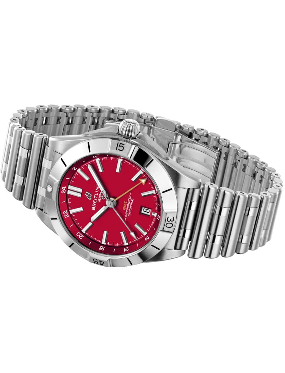 Side view of Breitling wristwatch with stainless steel case and bracelet, and red dial.