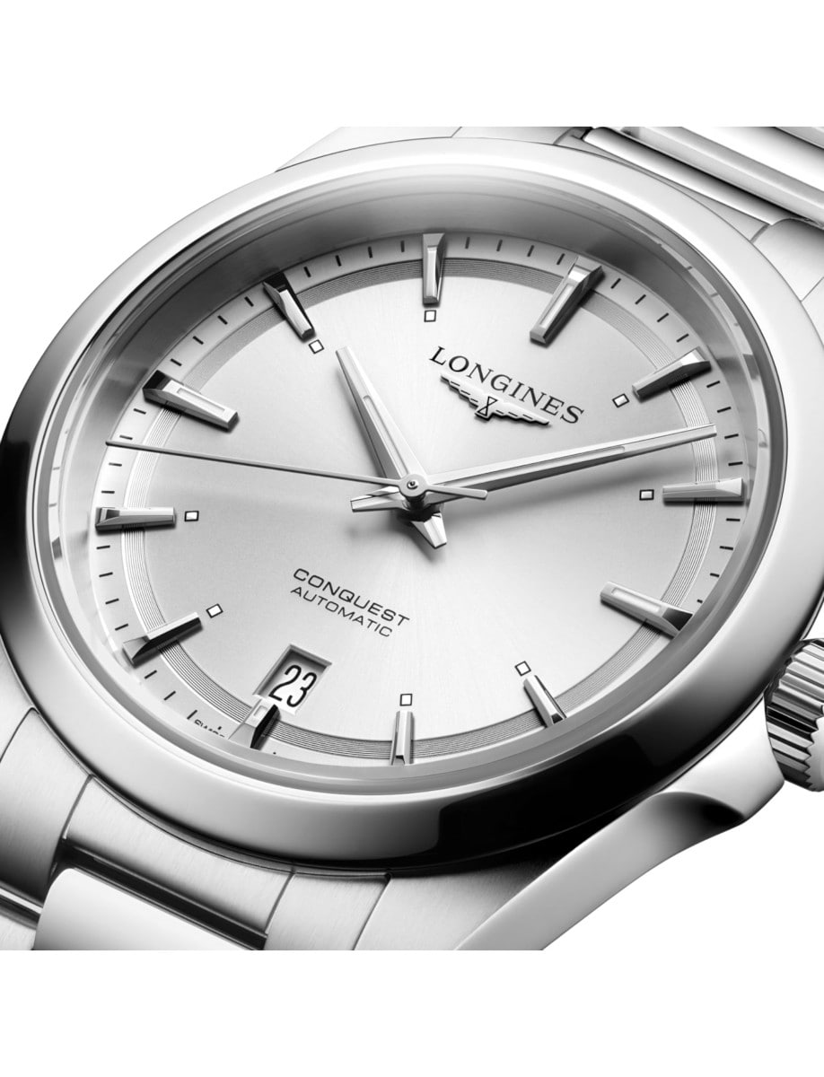 Close view of Longines wristwatch with stainless steel case and bracelet, and sunray silver dial.