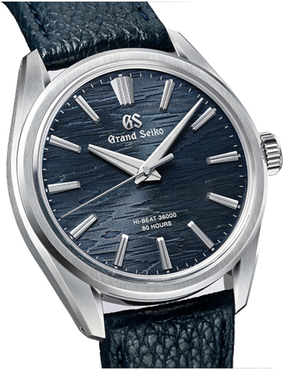 Side view of Grand Seiko wristwatch with stainless steel case, blue dial, and blue cow leather strap.
