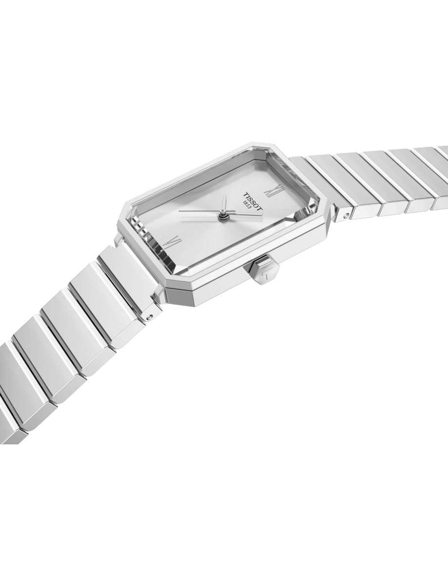 Side view of Tissot wristwatch with stainless steel case and bracelet and silver dial