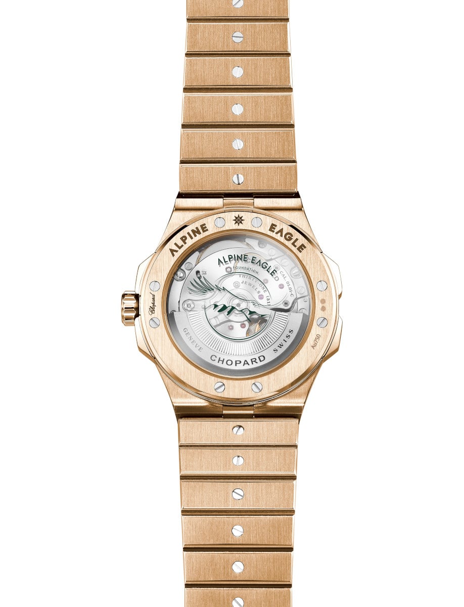 Back view of Chopard wristwatch with 18K rose gold case and bracelet, and transparent case back.