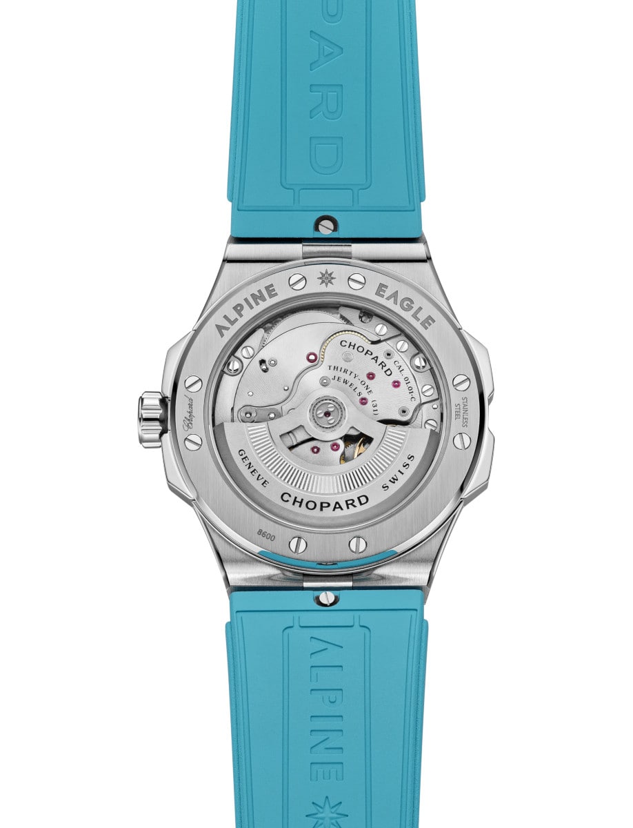 Back view of Chopard with stainless steel and transparent caseback  and blue rubber strap