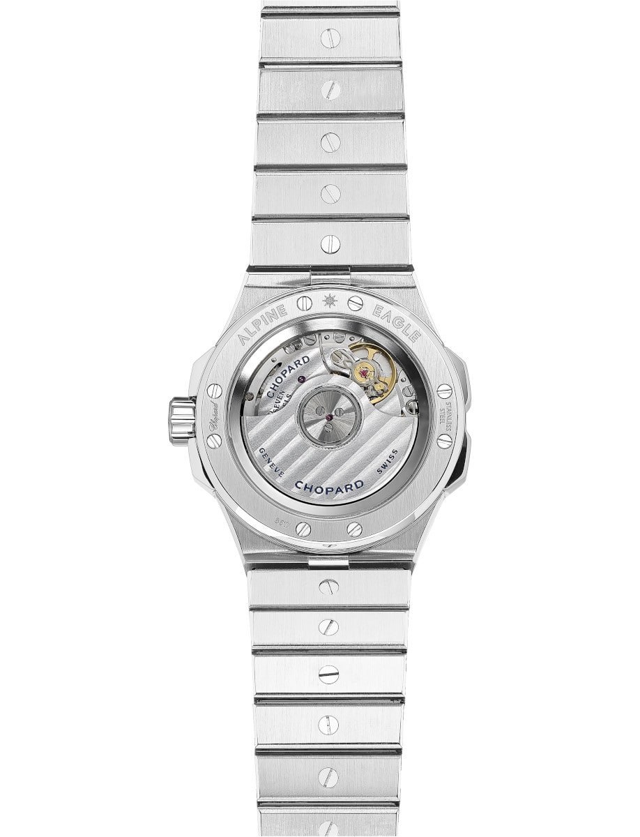 Backview of Chopard wristwatch with stainless steel case and bracelet, and transparent case back.