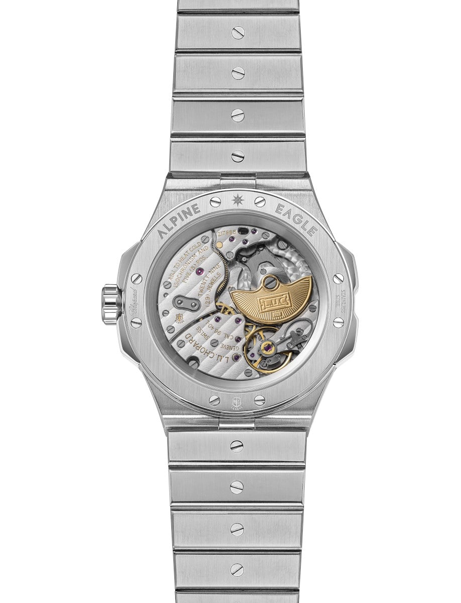 Back view of Chopard wristwatch with stainless steel case and bracelet, and transparent case back.