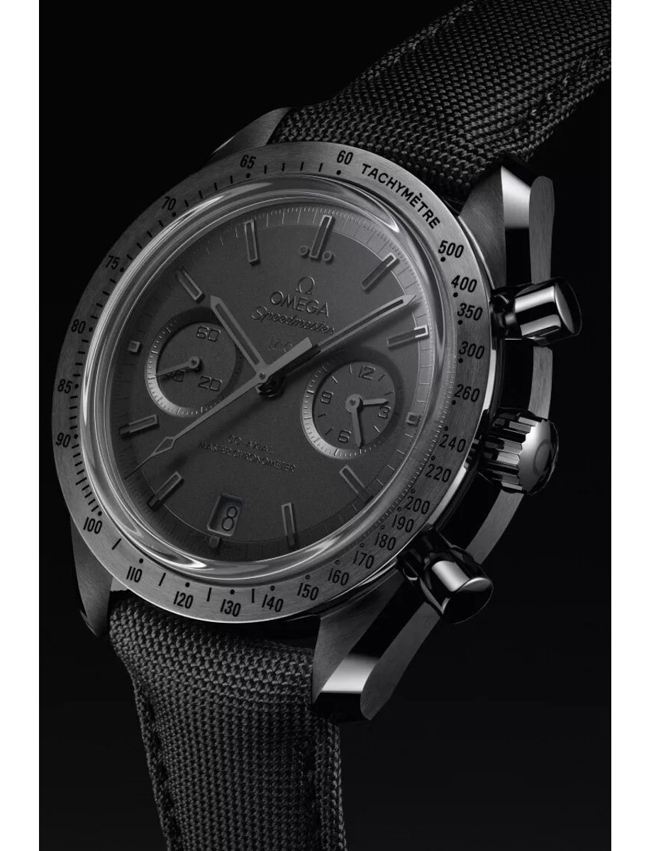 Side view of Omega wristwatch with black ceramic case, black dial and black nylon fabric strap