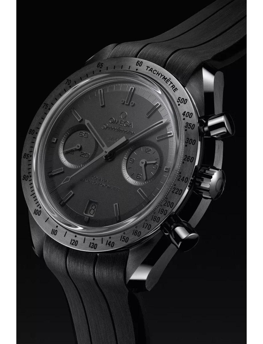 Side view of Omega wristwatch with black ceramic case, black dial and black rubber strap